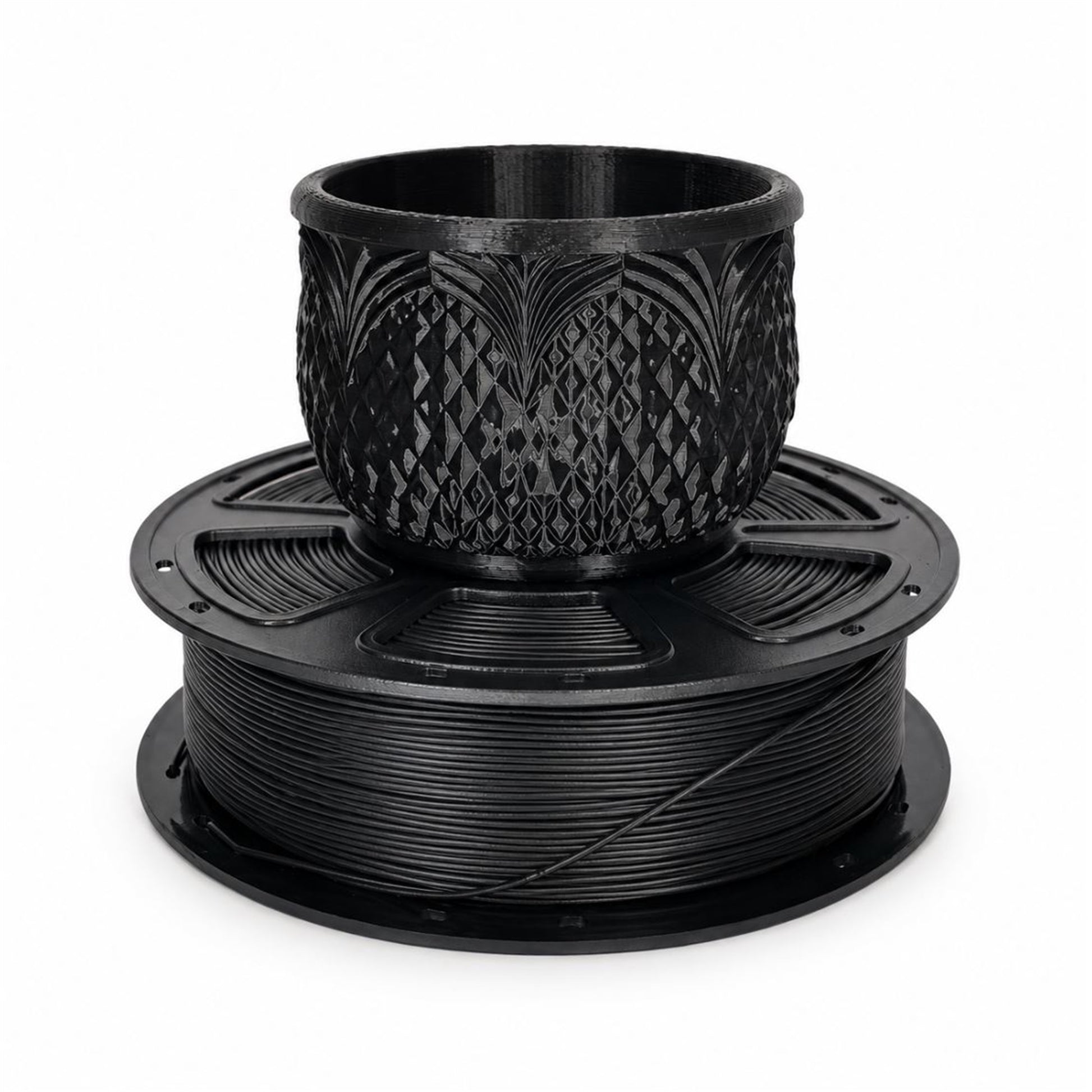 Black PLA filament spool with a detailed printed planter