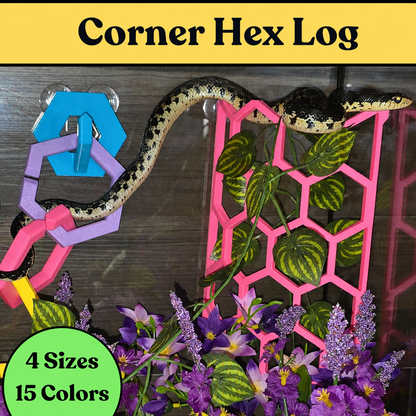 Snake climbing through colorful Corner Hex Log enrichment structures in a planted reptile enclosure.